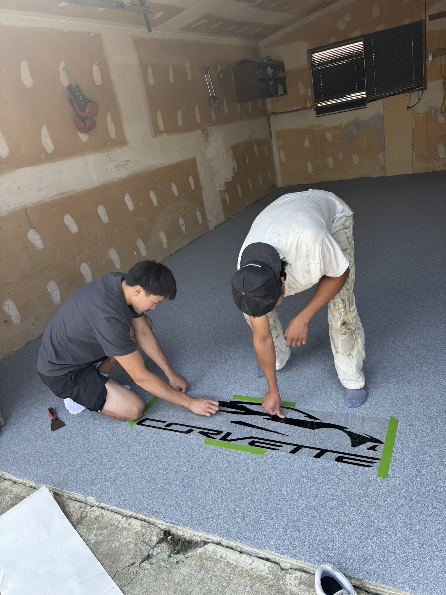 Craftsmen putting decal on quartz floor