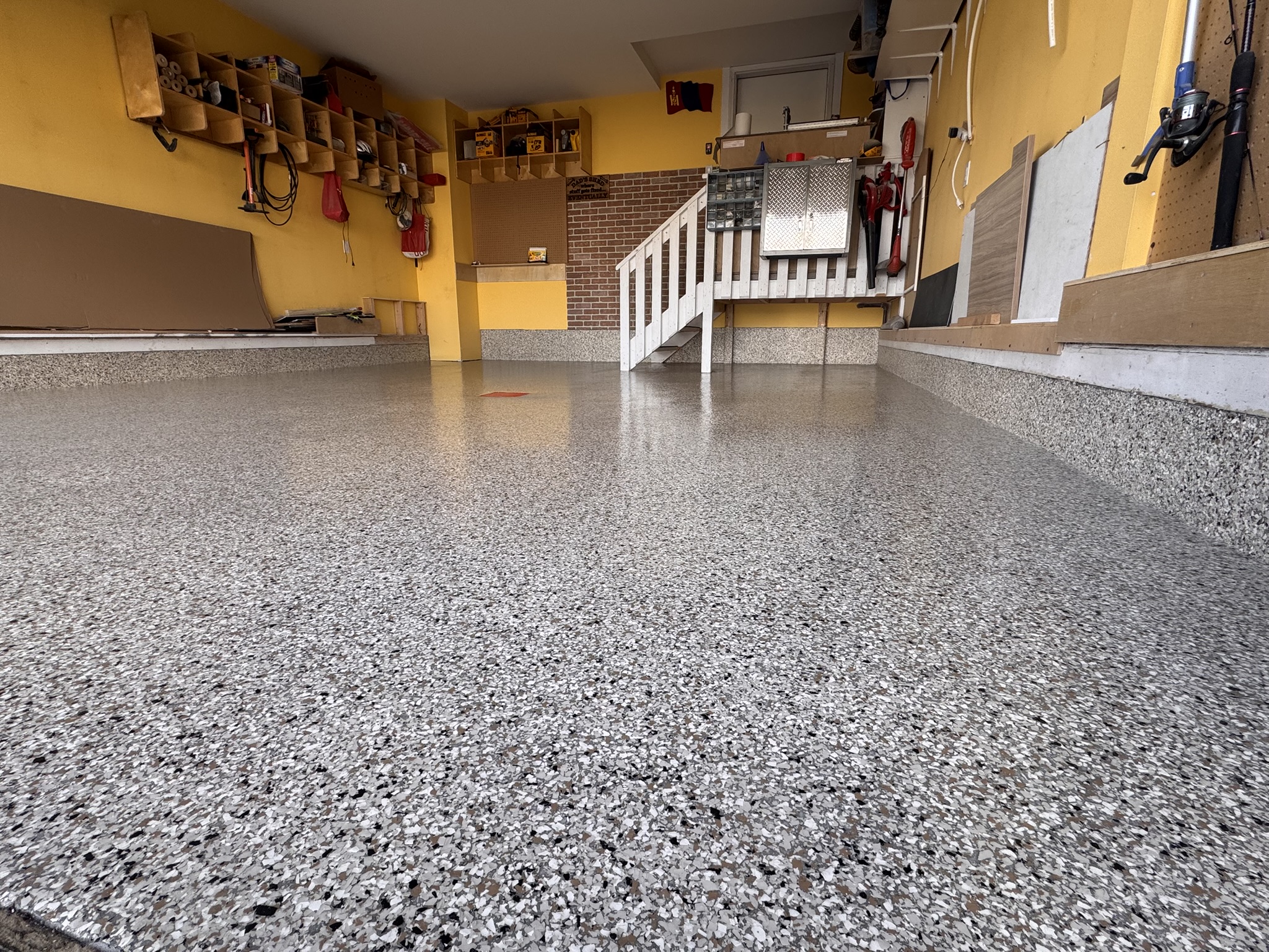 Installer applying decal to quartz floor